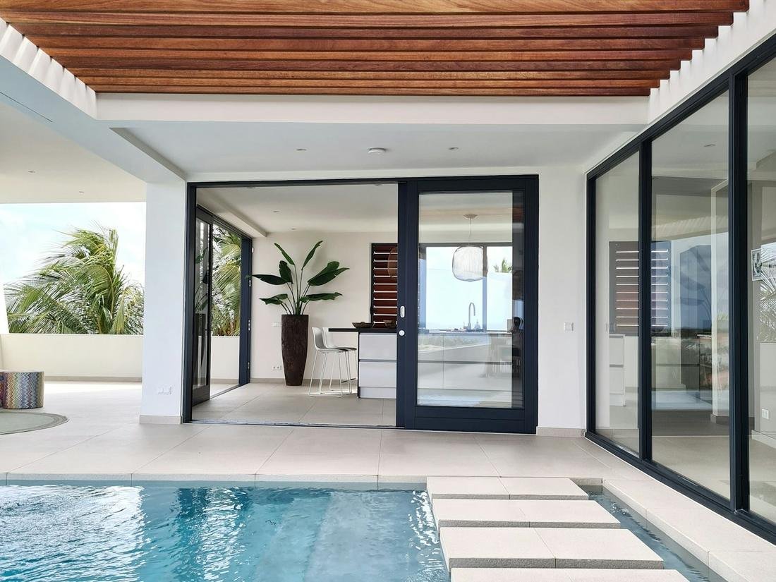 Pool deck with large sliding glass doors